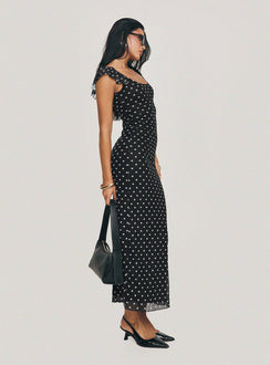 side view of model wearing Princess Polly Sandberg Maxi Dress Black Polka Dot Scoop Neck 