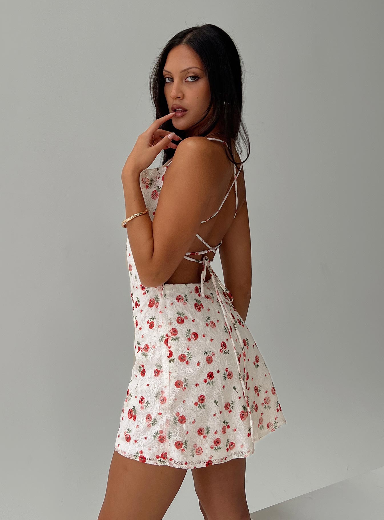 side view of model wearing Princess Polly Celena Lace Mini Dress White / Red Floral Sweetheart Neckline 