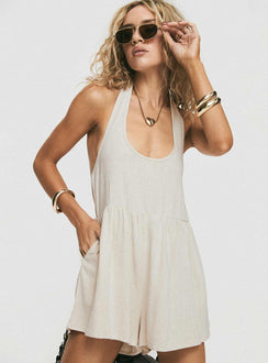 Romper Halter neck tie fastening, scooped neckline, low back, invisible zip fastening at side, twin hip pockets Non-stretch, unlined