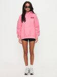 side view of model wearing Princess Polly Princess Polly Hooded Sweatshirt Bubble Text Pink / Red 