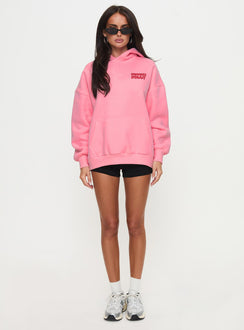side view of model wearing Princess Polly Princess Polly Hooded Sweatshirt Bubble Text Pink / Red Long 