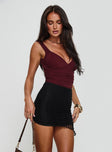   side view of model wearing Princess Polly Ecstasies Asymmetrical Mini Skirt Black Mini Skirts 