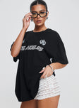 side view of model wearing Princess Polly Goal La Oversized Tee Black Half Sleeves Crew Neck 