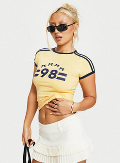 side view of model wearing Princess Polly Salda Top Lemonade / Navy Short Sleeves Crew Neck 