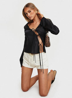 side view of model wearing Princess Polly Mariah Long Sleeve Top Black Full Sleeves Plunger 