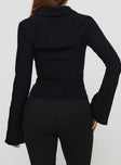 back view of model wearing Princess Polly Alexandar Long Sleeve Top Black Full Sleeves V-Neck 