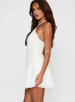 side view of model wearing Princess Polly Flowerchild Halter Mini Dress White Asymmetric Neckline 