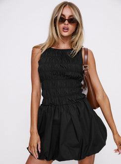 front view of model wearing Princess Polly Demure Shirred Bubble Hem Mini Dress Black Scoop Neck 