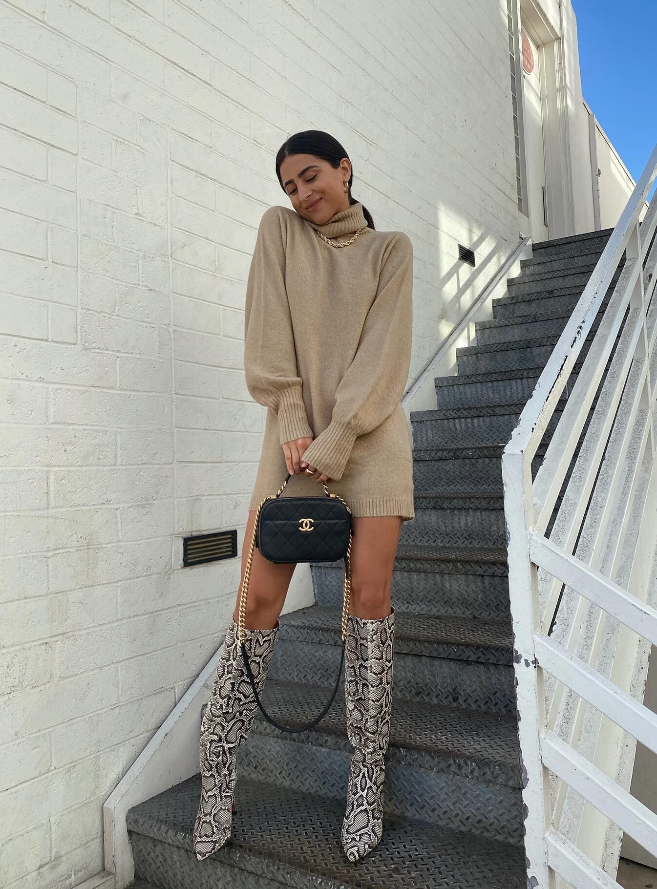 back view of model wearing Princess Polly Zahara Mini Dress Beige Petite High Neck 