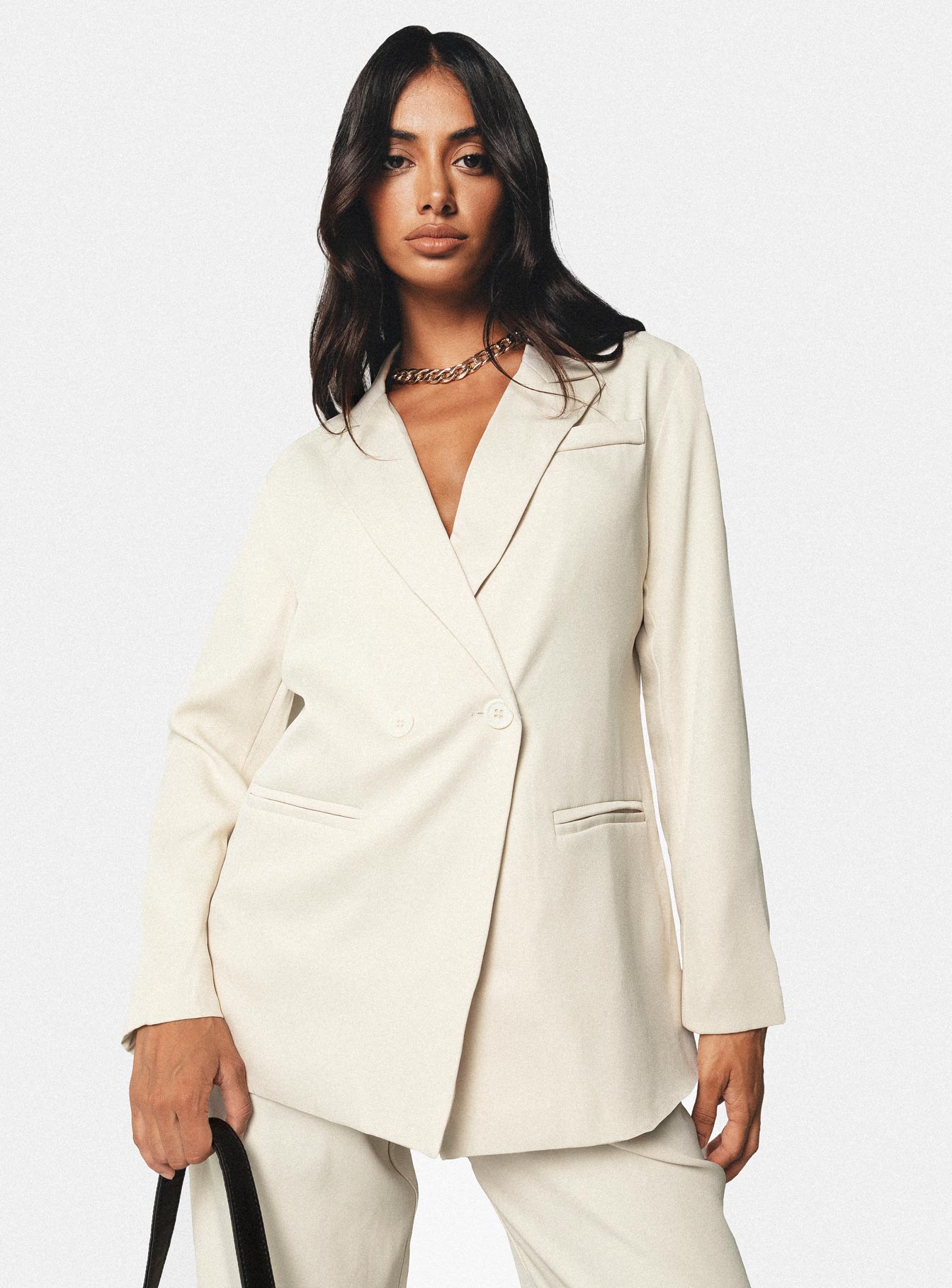 Blazer Silky material  Lapel collar  Double-breasted  Twin hip pockets  Non-stretch 