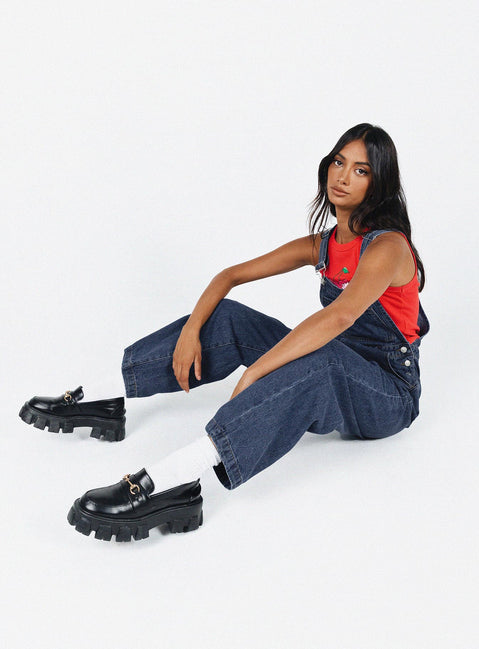 Overalls Cord material  Adjustable shoulder straps  Button fastening at hips  Chest pocket  Wide leg 