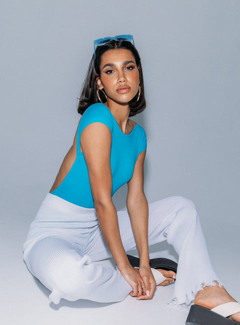 back view of model wearing Princess Polly Shila Bodysuit Blue Short Sleeves Boat Neck 