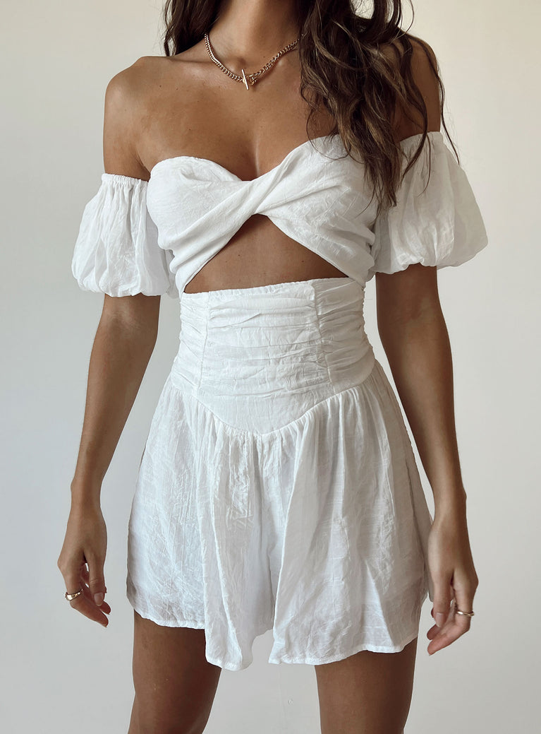 Romper Off the shoulder puff sleeves  Removable & adjustable shoulder straps  Twisted bust  Cut out midriff  Shirred back 