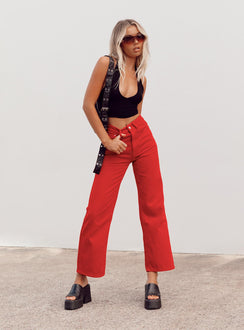 side view of model wearing Princess Polly Denver Denim Jeans Red Mid Rise 