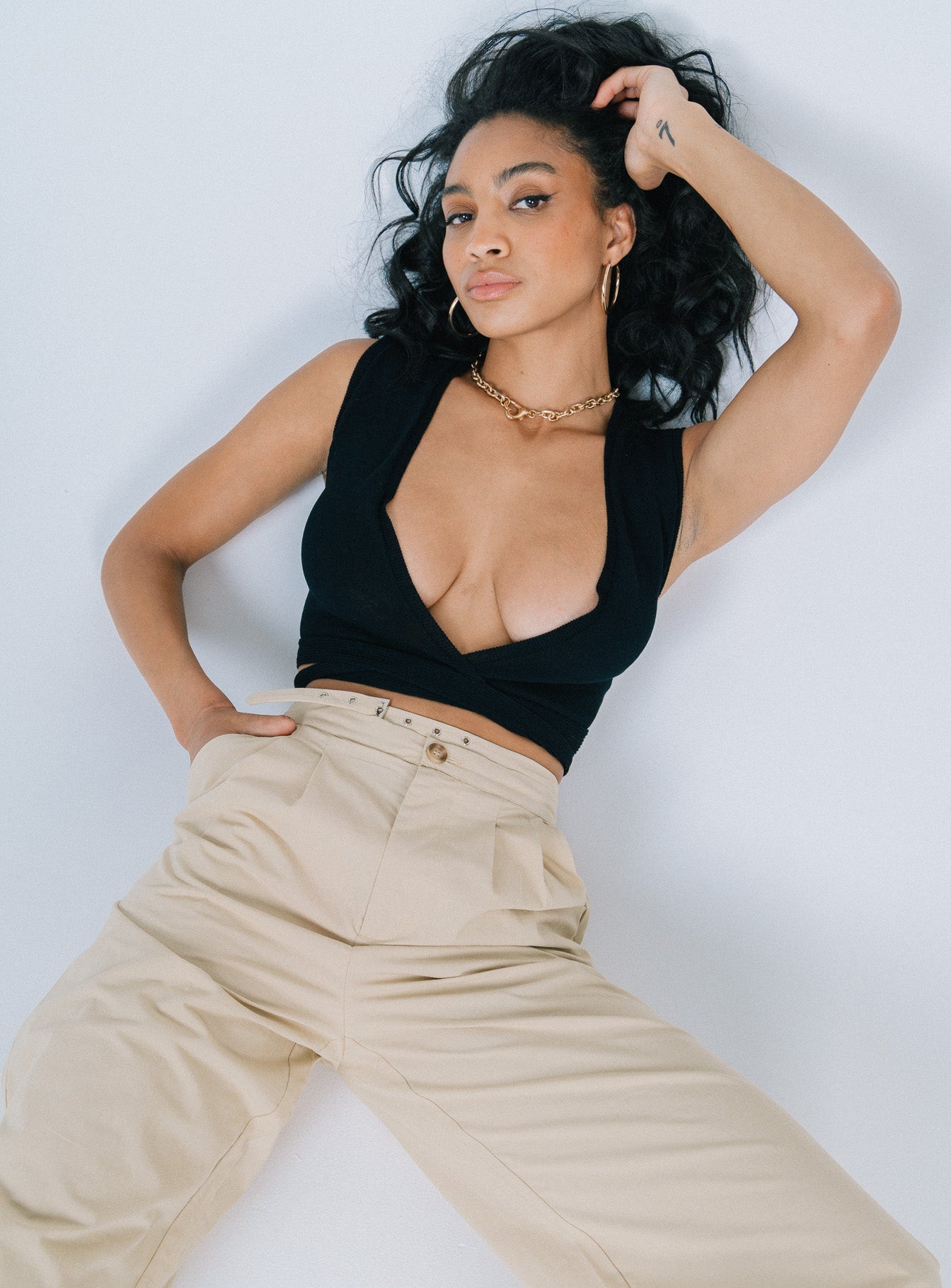 front view of model wearing Princess Polly Savani Top Black Sleeveless Plunger 