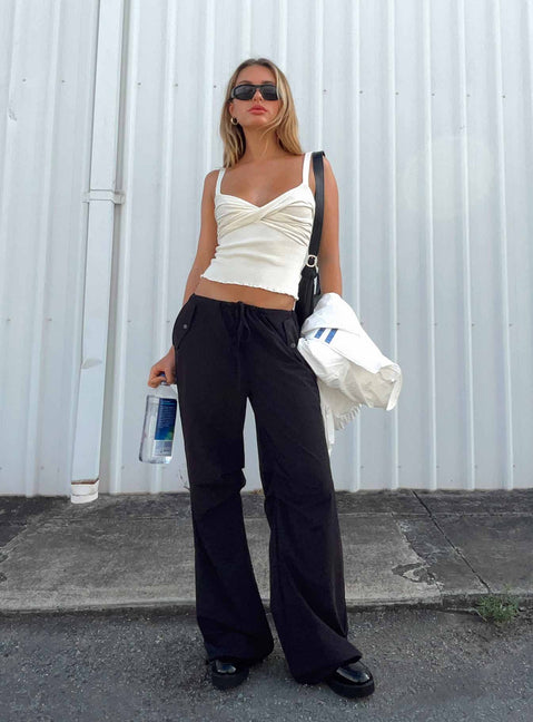 Front view of model wearing  front Princess Polly High Waisted Pants  Snow Parachute Pants Black