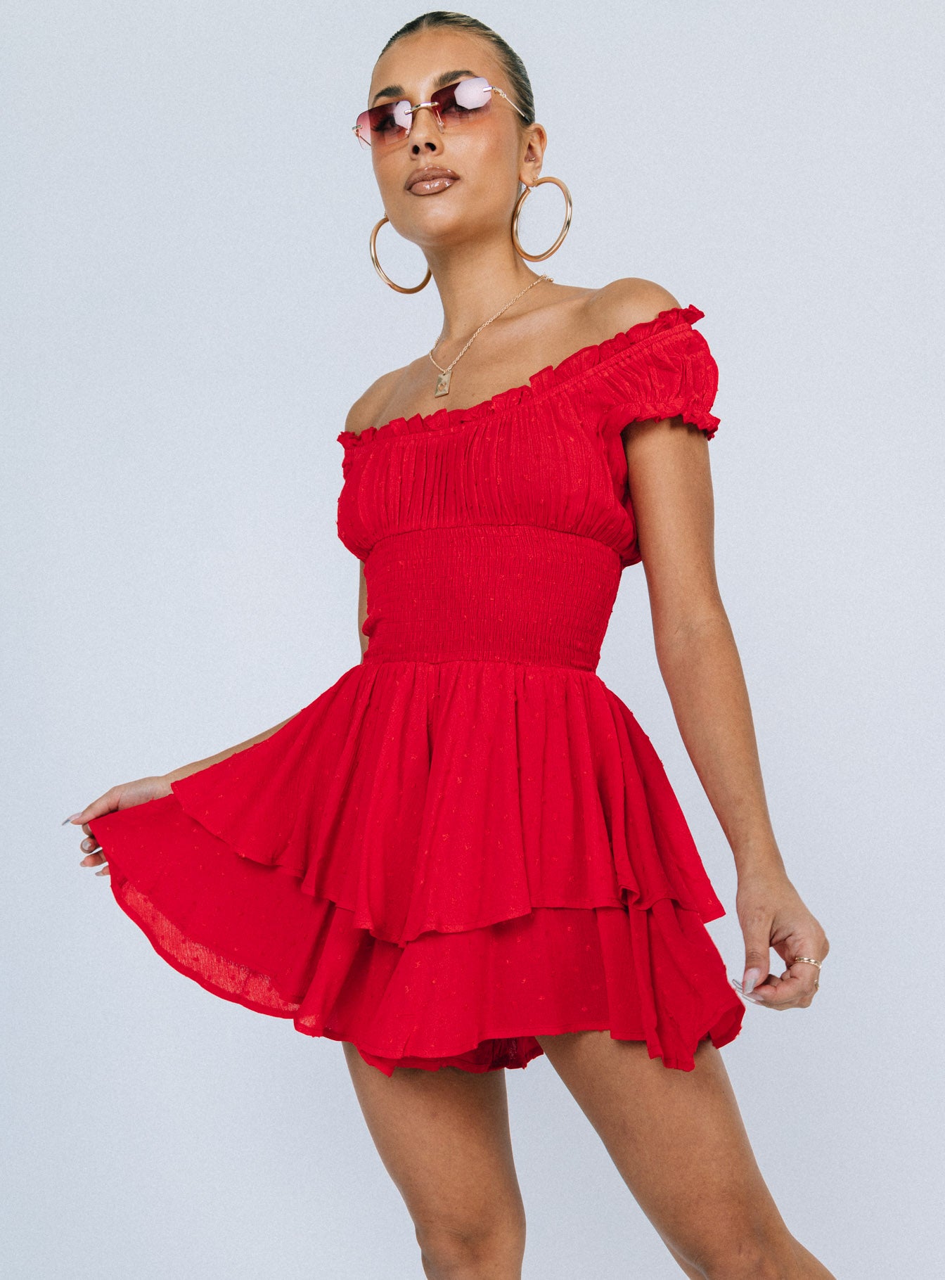 Romper Soft textured material Shirred waistband Ruffle detailing Elasticated neck and sleeves Good stretch   Fully lined