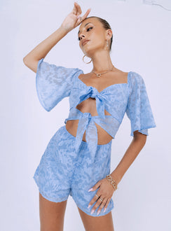 Romper Stitched floral print  Sheer material  Elasticated shoulders  Double tie front fastening  Elasticated waist  Invisible zip fastening at back 