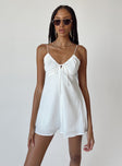 Romper Silky material  Lace trimming  Elasticated shoulders Tie at bust  Shirred back  Invisible zip fastening at back 