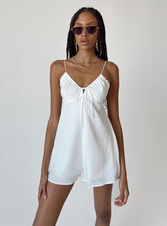 Romper Silky material  Lace trimming  Elasticated shoulders Tie at bust  Shirred back  Invisible zip fastening at back 
