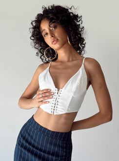 side view of model wearing Princess Polly Ashbourne Top White Sleeveless Plunger 