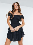 Black romper Shirred waistband Ruffle detailing Elasticated neck and sleeves Can be worn on or off shoulder Layered ruffle hem Fully lined