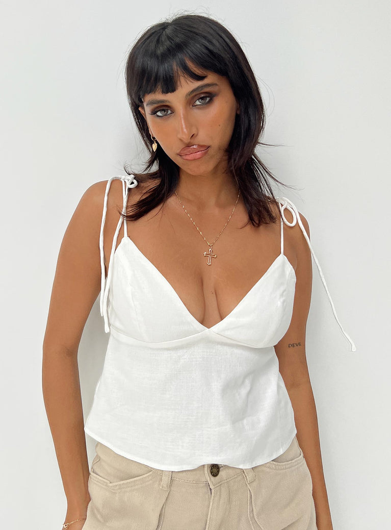 White crop top Adjustable shoulder straps with tie fastening V neckline Elasticated bands at back Non stretch Partially lined