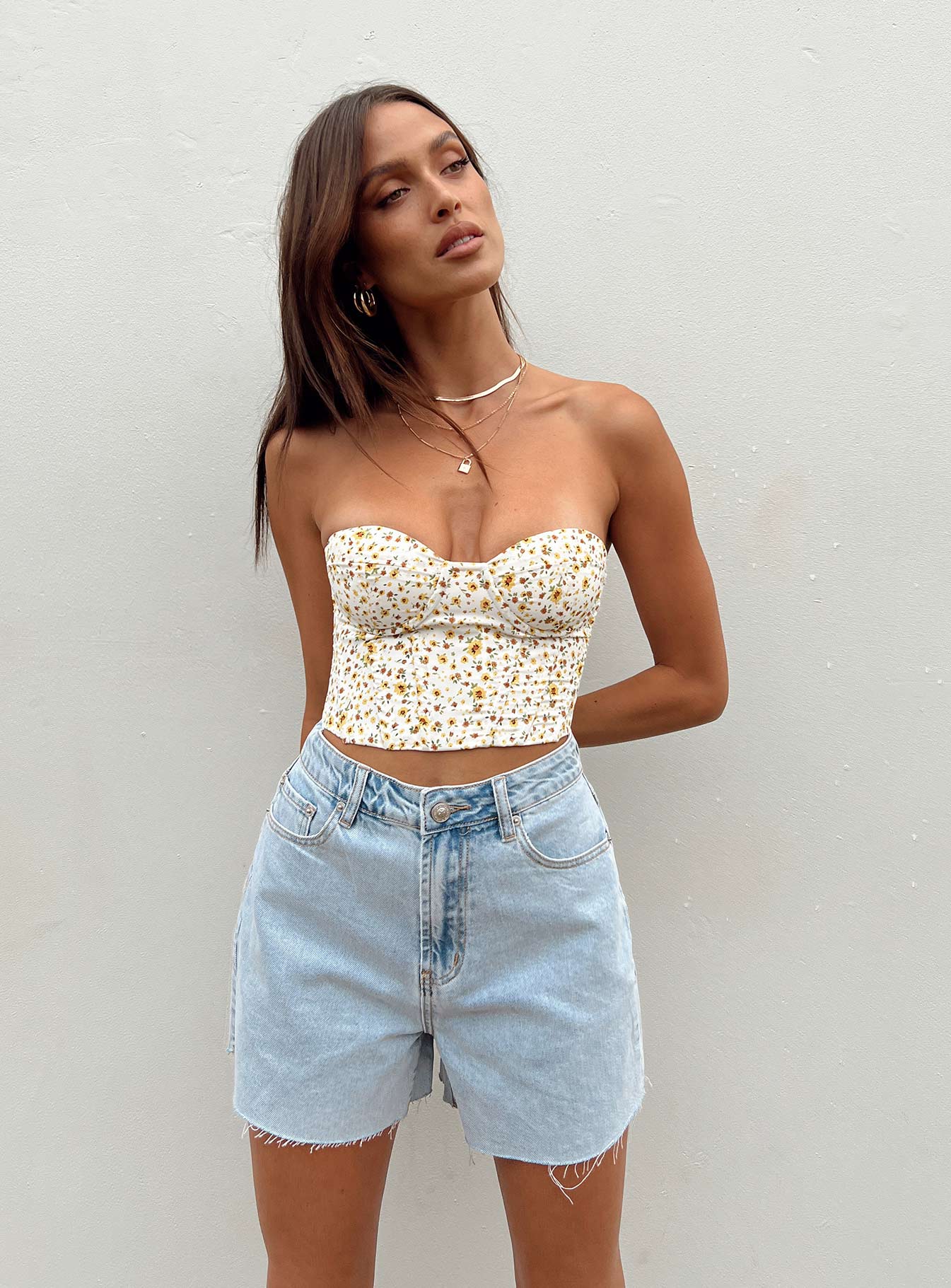 Denim shorts Light wash denim High waisted design Belt looped waist Zip & button fastening Classic five-pocket design Raw edge hem