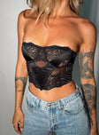 Strapless crop top Silky material Lace detailing Inner silicone strip at bust Wired cups Boning at front Zip fastening at back Pointed hem