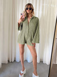 Long sleeve romper Textured material  Classic collar Button fastening at front Good stretch