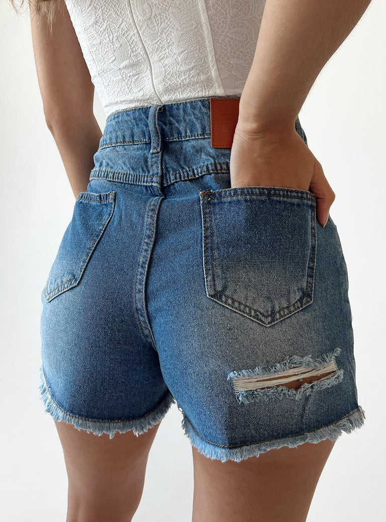 Shorts Dark wash denim  Zip & button fastening  Belt looped waist  Four-pocket design  Ripped leg  Frayed hem 