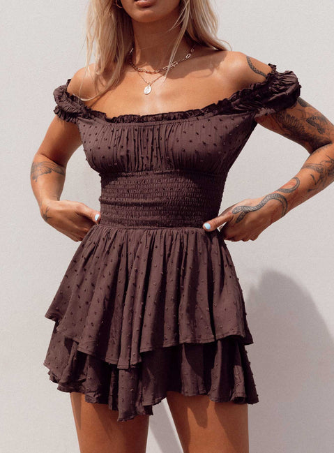 Romper Soft textured material Shirred waistband Ruffle detailing Elasticated neck and sleeves Can be worn on or off shoulder Layered ruffle hem Fully lined