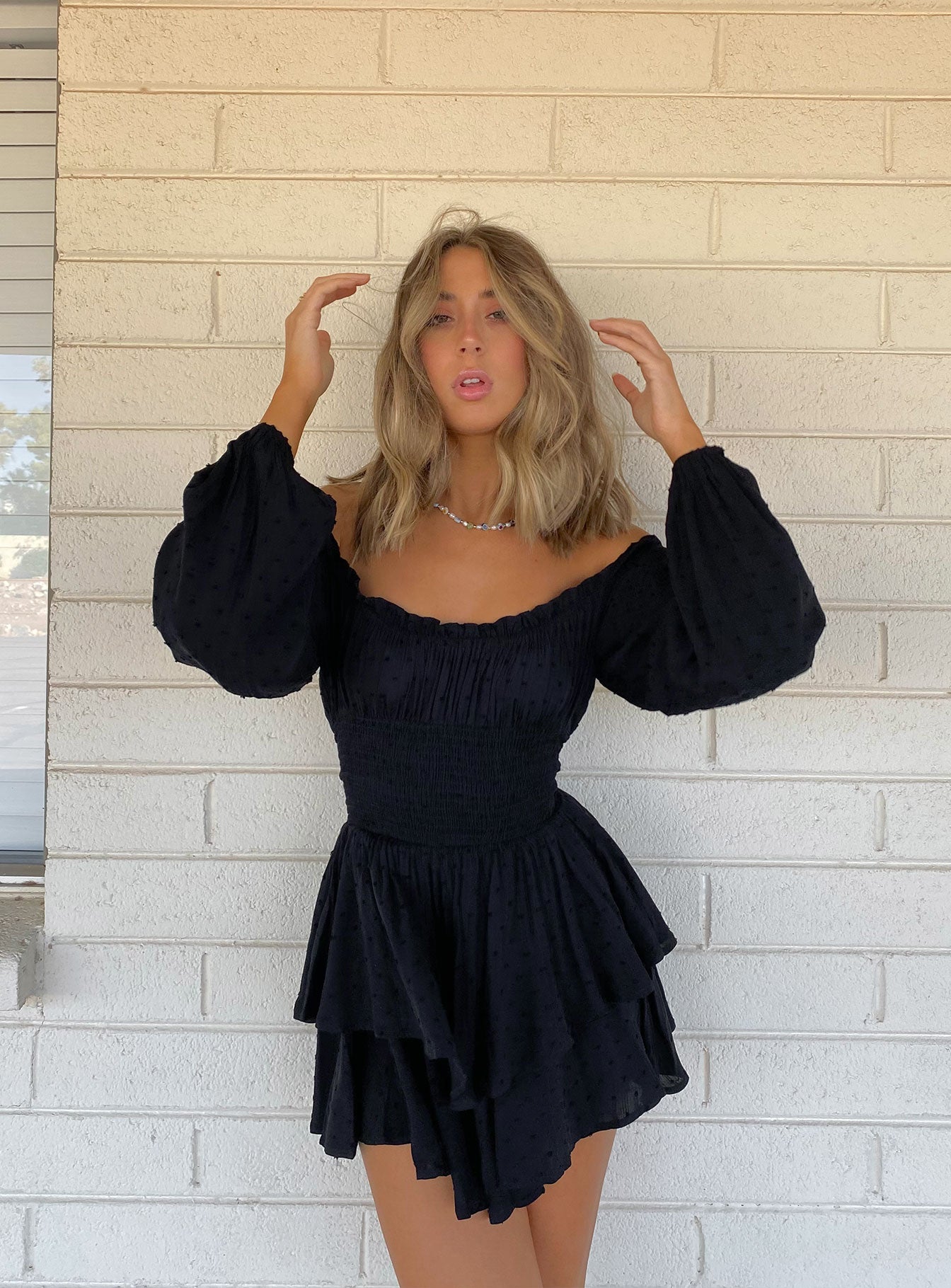 Long sleeve romper Soft textured material Shirred waistband Ruffle detailing Elasticated neck and sleeves Can be worn on or off shoulder Layered ruffle hem