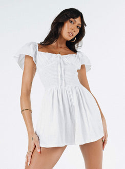 White romper Elasticated shoulders & neckline  Tie at bust  Shirred waist  Twin hip pockets  Fully lined 