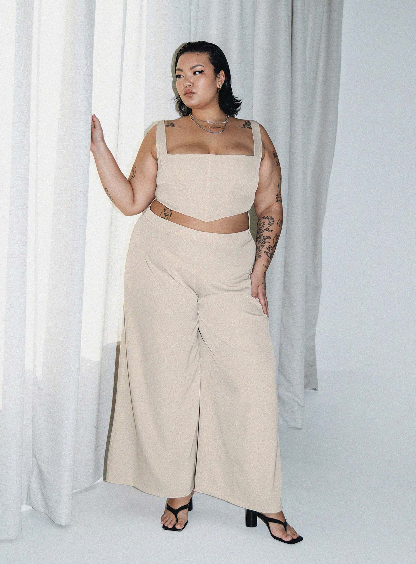 Matching set Corset top  Fixed straps Boning through front  Pointed hem Zip fastening at back  High waisted pants  Invisible zip fastening at side  Wide leg 