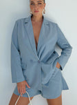 Blue blazer Lapel collar Button fastening at front Shoulder pads Faux hip pockets Split at back