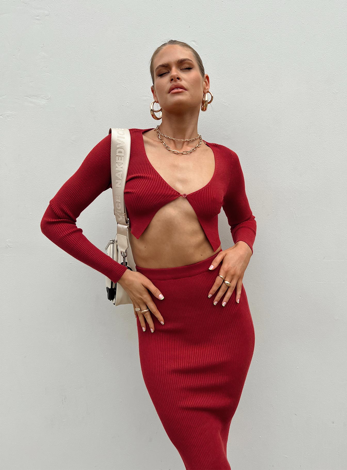 Matching set Ribbed knit material Long sleeve top V-neckline Single button fastening at front Maxi skirt Elasticated waistband