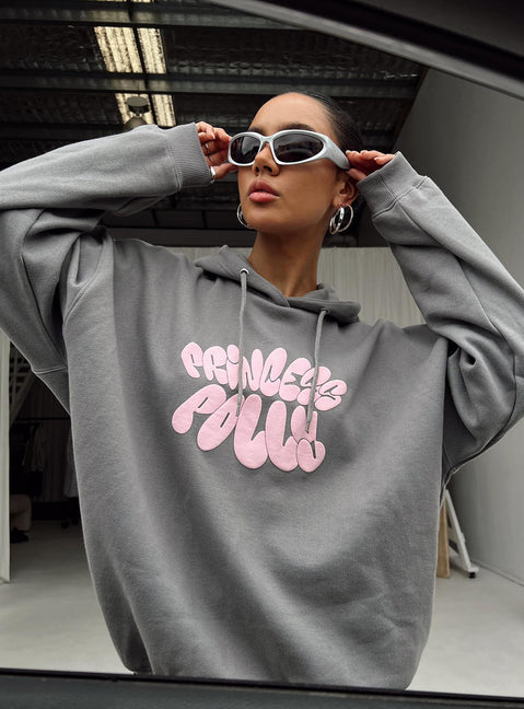 side view of model wearing Princess Polly Princess Polly Hooded Sweatshirt Bubble Text Charcoal / Light Pink Long 