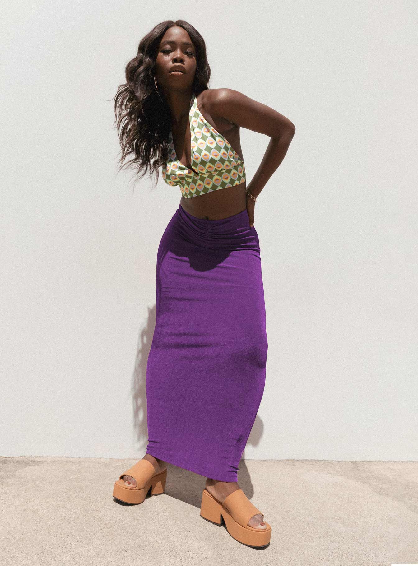   side view of model wearing Princess Polly Danna Maxi Skirt Purple 