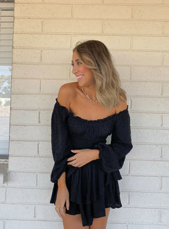 Long sleeve romper Soft textured material Shirred waistband Ruffle detailing Elasticated neck and sleeves Can be worn on or off shoulder Layered ruffle hem