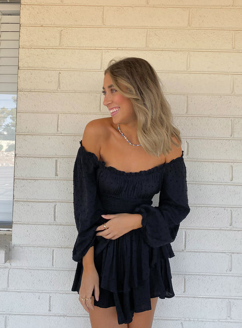 Long sleeve romper Soft textured material Shirred waistband Ruffle detailing Elasticated neck and sleeves Can be worn on or off shoulder Layered ruffle hem