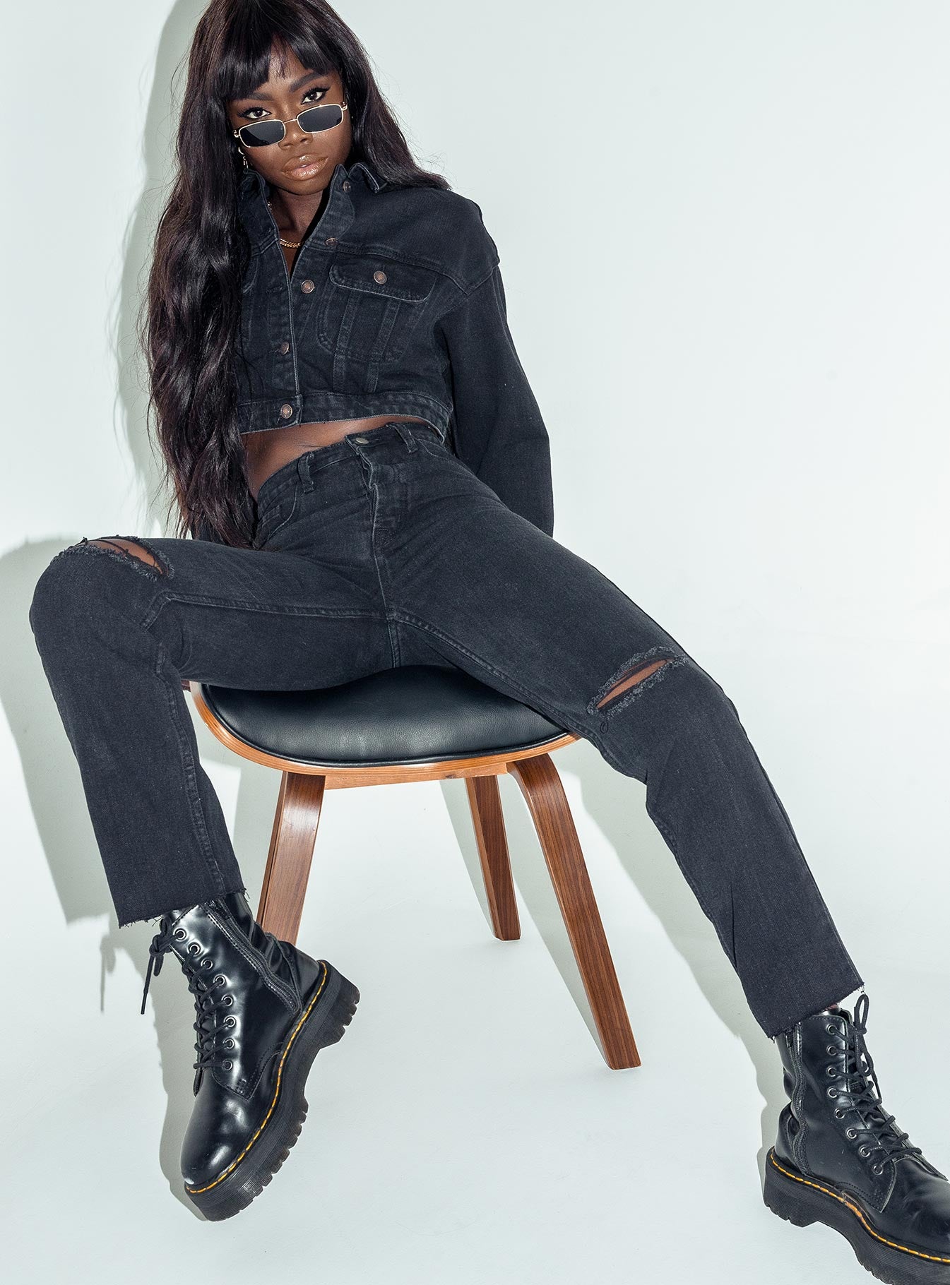 front view of model wearing Princess Polly Attica Knee Rip Denim Jeans Black Mid Rise 