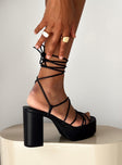 Heels Thin strappy upper  Ankle wrap tie fastening  Platform base  Block heel 