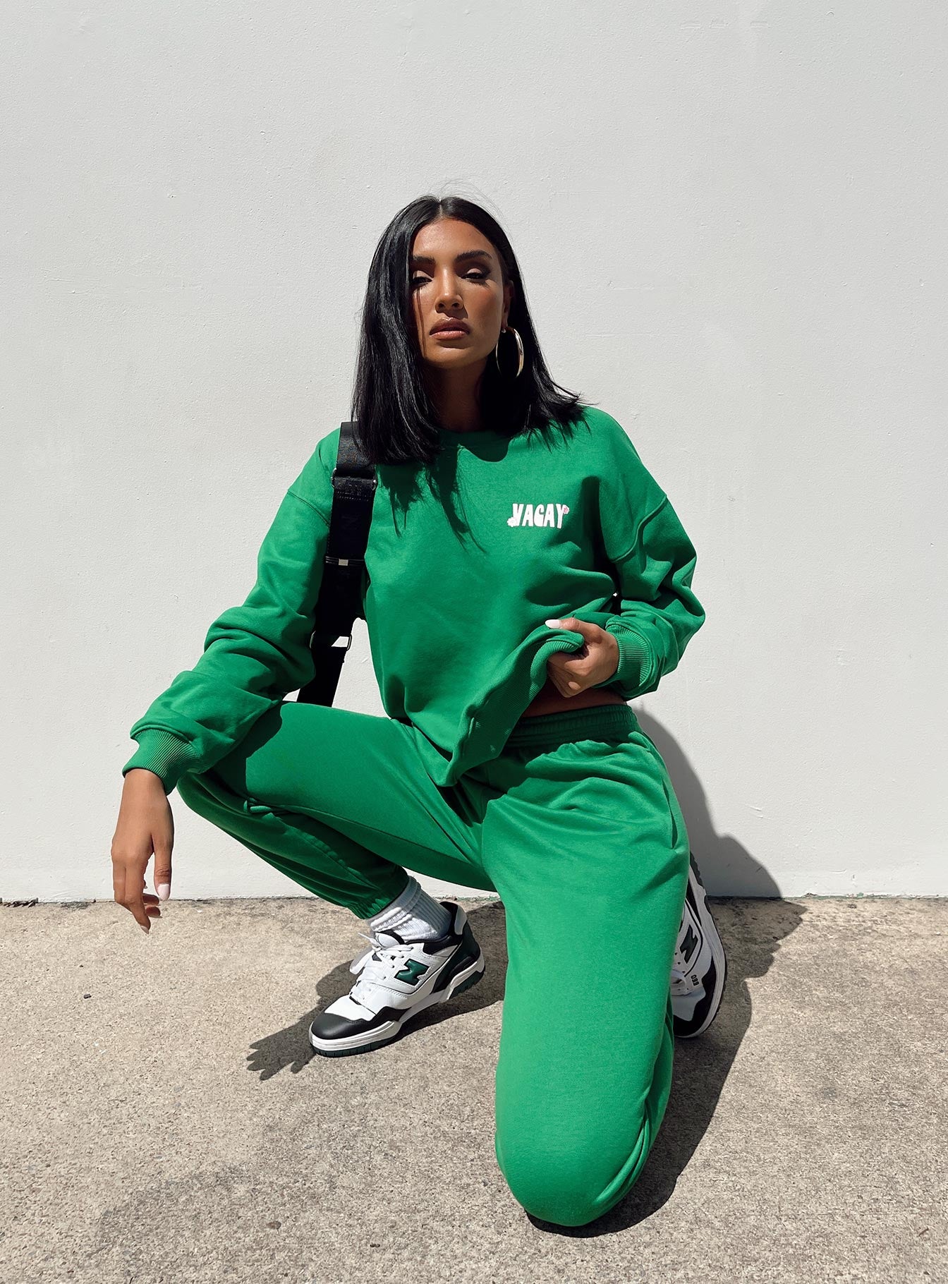 front view of model wearing Princess Polly Club Basic Trackpants Green 