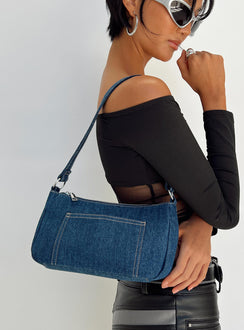 Shoulder bag Dark wash denim material Fixed shoulder strap Zip fastening Silver toned hardware External and internal slip pockets