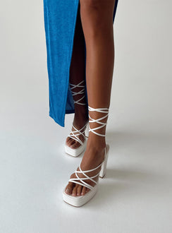 White heels Faux leather material  Strappy upper  Ankle tie fastening  Platform base  Block heel  Square toe 