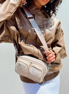 Crossbody bag Nylon material  Silver-toned hardware  Three external pockets  Zip fastenings  Internal pockets  Removable & adjustable strap  Flat base