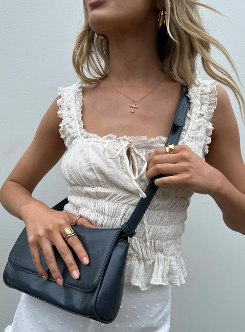 Should bag Faux leather material  Removable & adjustable shoulder strap  Magnetic button fastening  Single internal pocket  External card slip at back  Flat base 