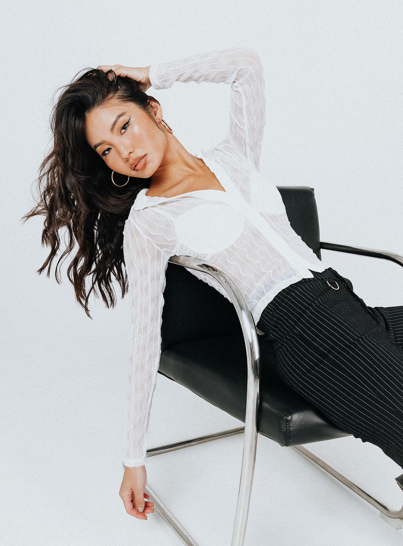 front view of model wearing Princess Polly Seren Long Sleeve Top White 