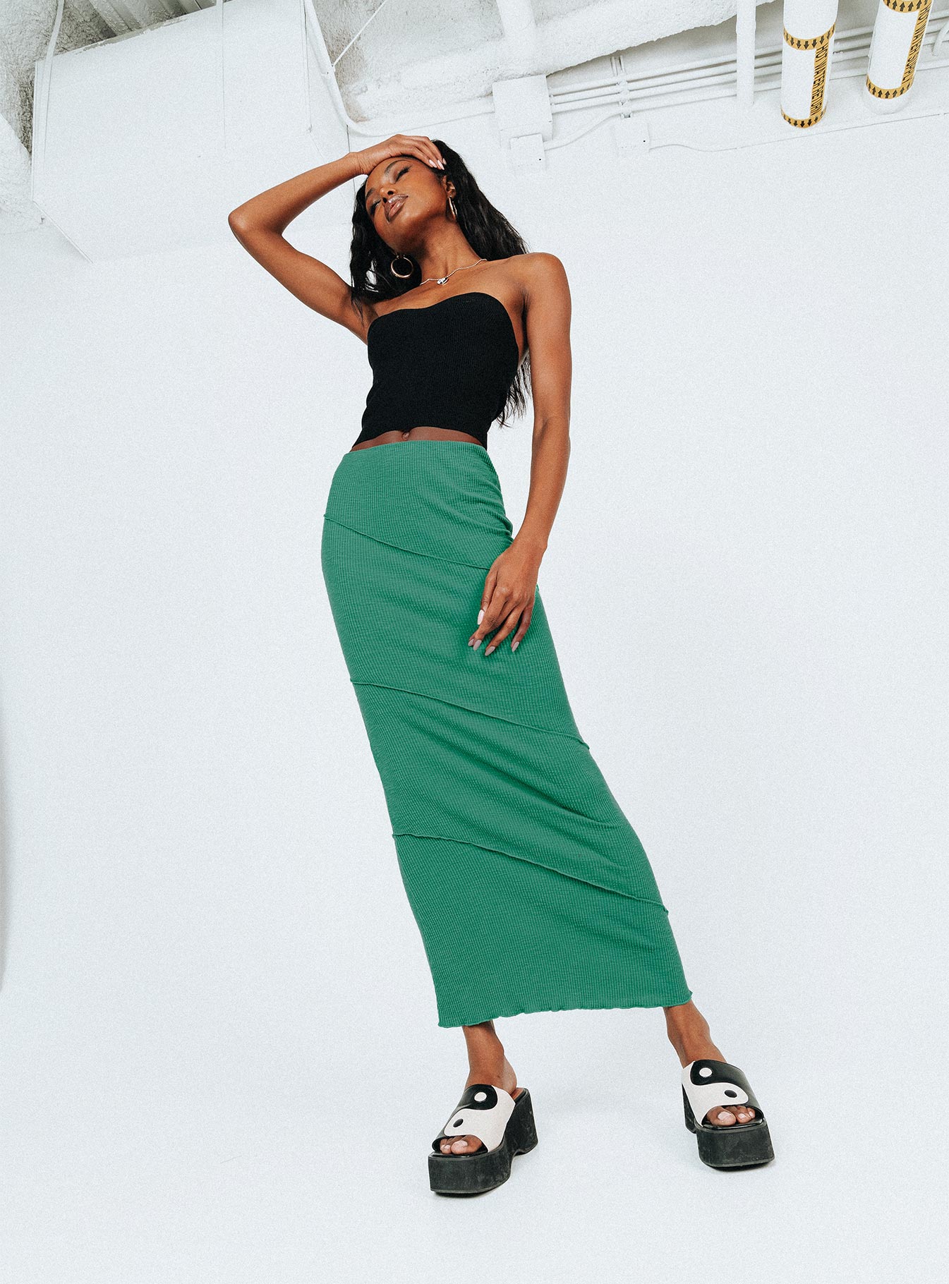   side view of model wearing Princess Polly Oscar Maxi Skirt Forest Green 